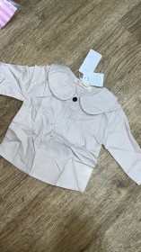 قميص نص زرار مع قبة دائرية