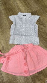 طقم تنورة زهري مع قميص نص كم منقط